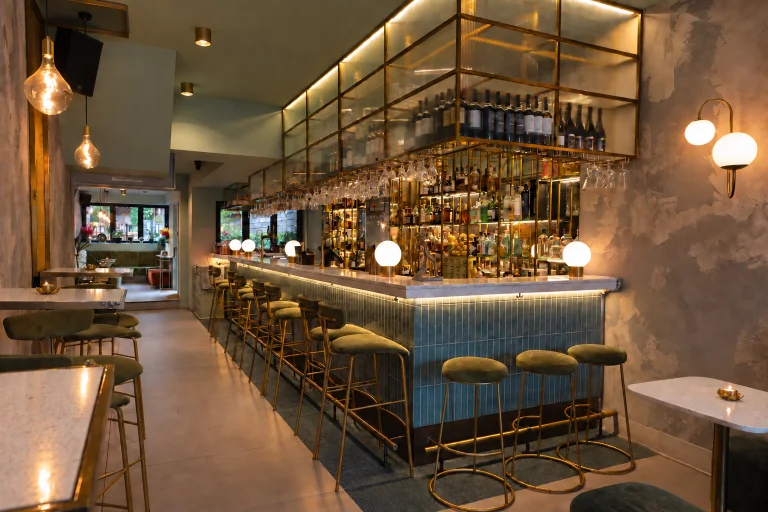 The illuminated bar, blue tiles and olive seating at ONE75